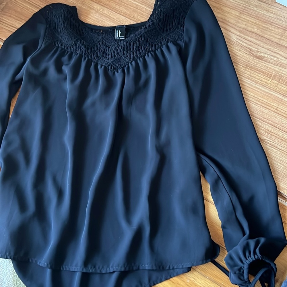 Long sleeve black top.